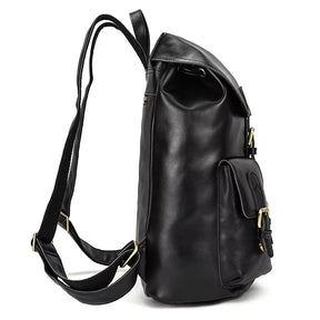 A side view of the Vintage Leather Backpack displays its sleek black design, crafted from genuine cowhide leather. It includes adjustable shoulder straps, a front pocket with a buckle closure, and a top handle. The material is smooth and slightly glossy, ideal for travel necessities.