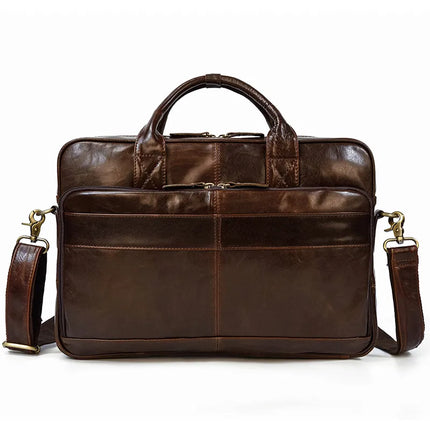 The Leather 16" Briefcase is a dark brown professional briefcase made from genuine cow leather. It features sturdy handles and an adjustable, detachable shoulder strap. The front includes a full-length zipper pocket and two smaller pockets for extra storage. The bag is accented with gold-tone hardware and has a sleek, polished finish.