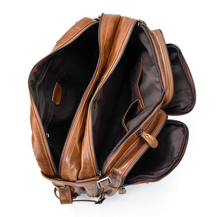 The Leather Travel Backpack Shoulder Bag, a luxury accessory crafted from brown leather, features multiple zippered compartments and pockets. The backpack is shown open, revealing an interior lined with dark fabric and several storage spaces ideal for organizing various essentials such as books and gadgets.