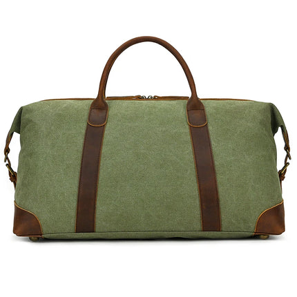 The Canvas & Leather Travel Duffle is a vintage-inspired green bag featuring genuine brown leather handles and accents. Ideal for travel or gym use, it boasts a spacious interior, sturdy design, zip closure, and side buckles for added security.