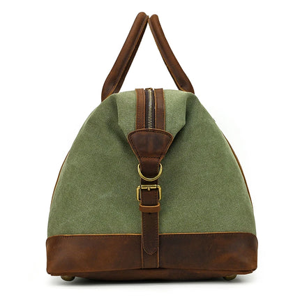The Canvas & Leather Travel Duffle is a vintage green bag with genuine leather accents, featuring a top zipper, front buckle strap, sturdy leather handles, and a reinforced base. Perfect for weekend travels.