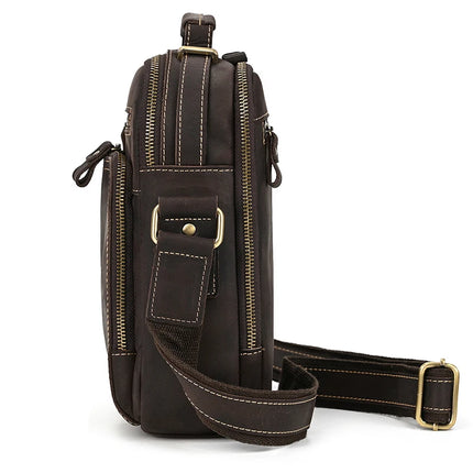 Here's a side view of the Dark Brown Leather Shoulder Bag, crafted from genuine cowhide leather with multiple gold zippers and a shoulder strap. The white stitching contrasts beautifully with the dark brown leather, and brass studs secure the strap and handle attachments. This compact yet spacious shoulder bag features durable alloy hardware for added strength.