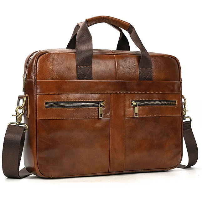 The Leather 16" Briefcase Handbag is a stylish and functional accessory made from genuine cow leather with a smooth, brown finish. It features two zippered pockets on the front, sturdy dark brown handles, and an adjustable shoulder strap with metal clasps. Its sleek design makes it ideal for professional use.