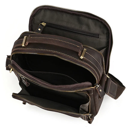  Image shows the Dark Brown Leather Shoulder Bag made from genuine cowhide leather, featuring multiple compartments. The top main section is unzipped, revealing another smaller zippered section inside, along with a front pocket. The bag also includes alloy hardware and a long shoulder strap.