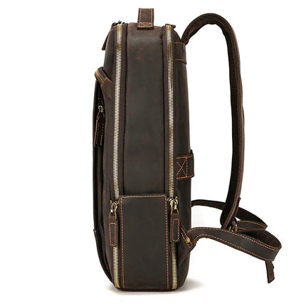Here's a side view of the Vintage Leather Daypack, crafted from dark brown genuine cowhide leather. It features multiple compartments, visible zippers, and adjustable padded shoulder straps. The backpack showcases prominent stitching details and includes a handle at the top. The background is plain white.