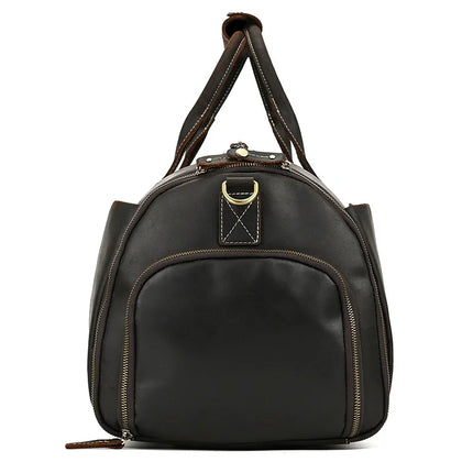 The Luggage 22 Leather Travel Duffle Bag, crafted from dark brown genuine leather, is displayed against a plain white background. The travel bag features a rounded top and a front zipper pocket, double shoulder straps, durable alloy hardware, and a metal ring at the top.