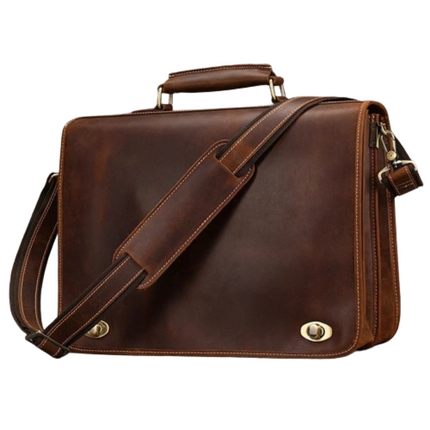 The Vintage Business Travel Briefcase is a brown leather satchel with a sturdy handle and an adjustable shoulder strap. This genuine leather briefcase features brass hardware, including two clasp locks in the front and a zipper on the side. The bag boasts clean stitching details, a polished appearance, and a dedicated laptop compartment.
