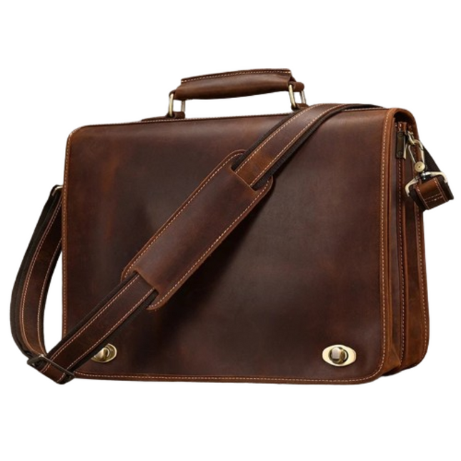 The Vintage Business Travel Briefcase is a brown leather satchel with a sturdy handle and an adjustable shoulder strap. This genuine leather briefcase features brass hardware, including two clasp locks in the front and a zipper on the side. The bag boasts clean stitching details, a polished appearance, and a dedicated laptop compartment.